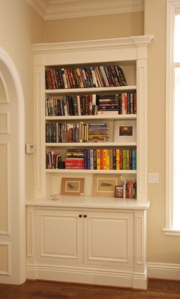 A bookshelf with a lot of books on it