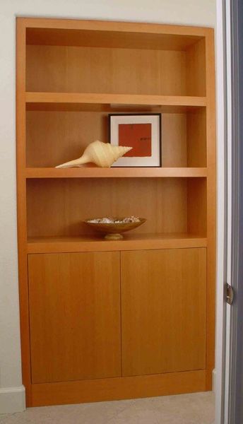 A wooden shelf with a picture on top of it