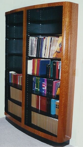 A bookshelf with a lot of books on it