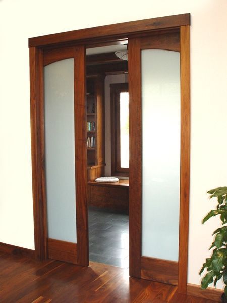 A room with sliding glass doors leading to a window