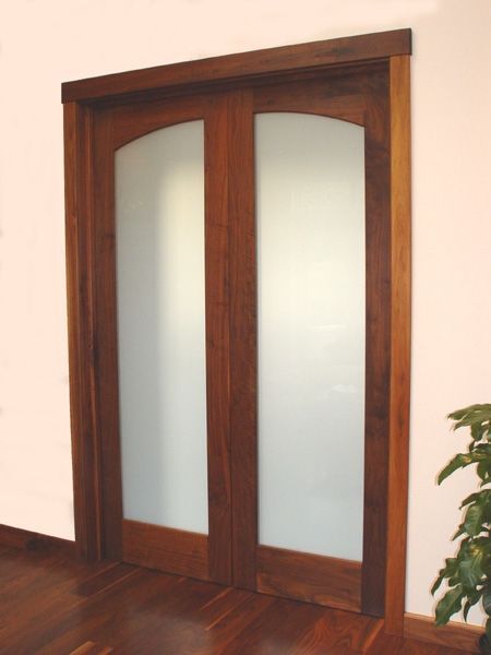 A wooden door with a plant in front of it