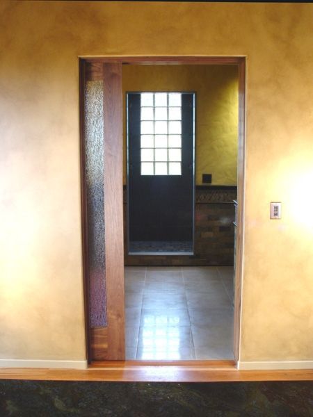 A doorway leading to a room with a window
