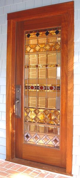 A wooden door with a stained glass window