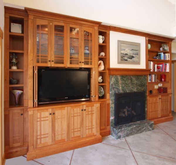 A living room with a fireplace and a flat screen tv