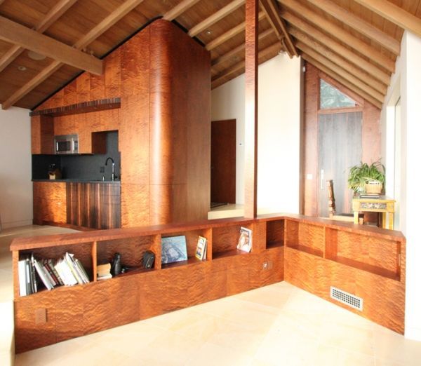 A living room with wooden shelves and a wooden ceiling
