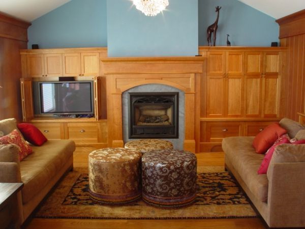 A living room with two couches and a fireplace