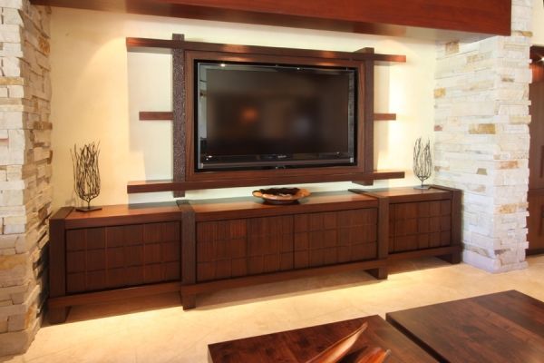 A living room with a large flat screen tv on the wall