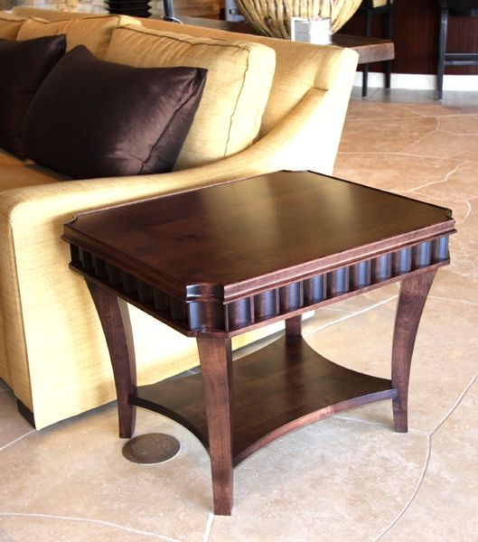 A small wooden table sits in front of a couch