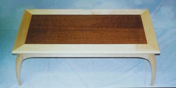 A wooden table with a wooden top and a wooden frame