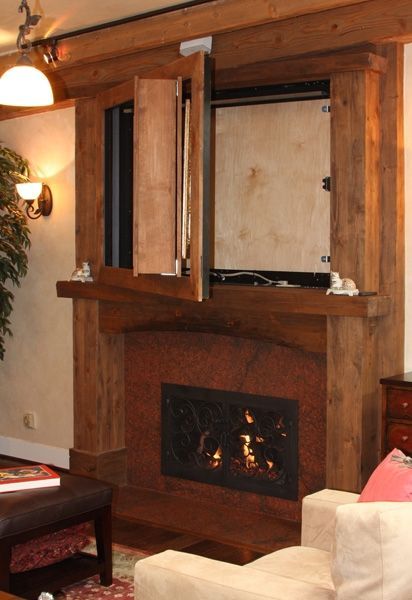 A living room with a fireplace and a flat screen tv