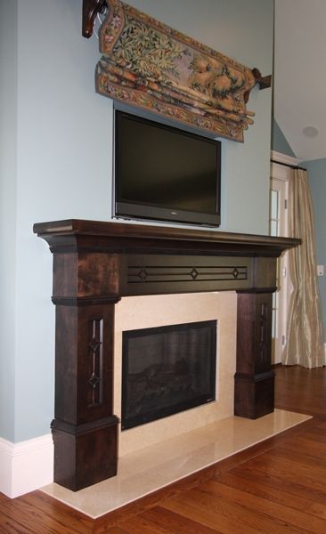 A fireplace with a flat screen tv above it