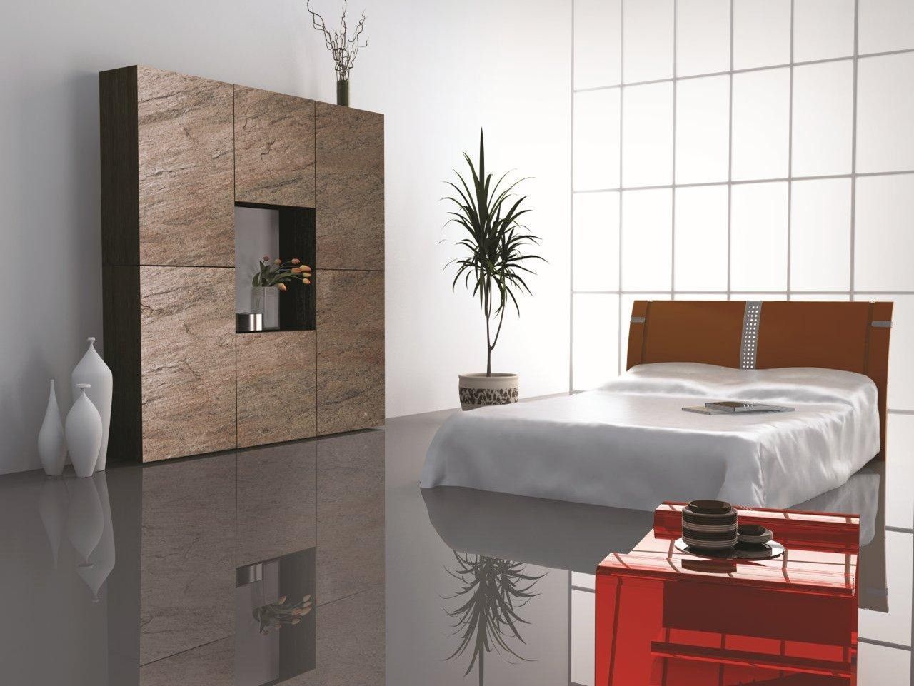 Una camera da letto con un letto e un comodino rosso