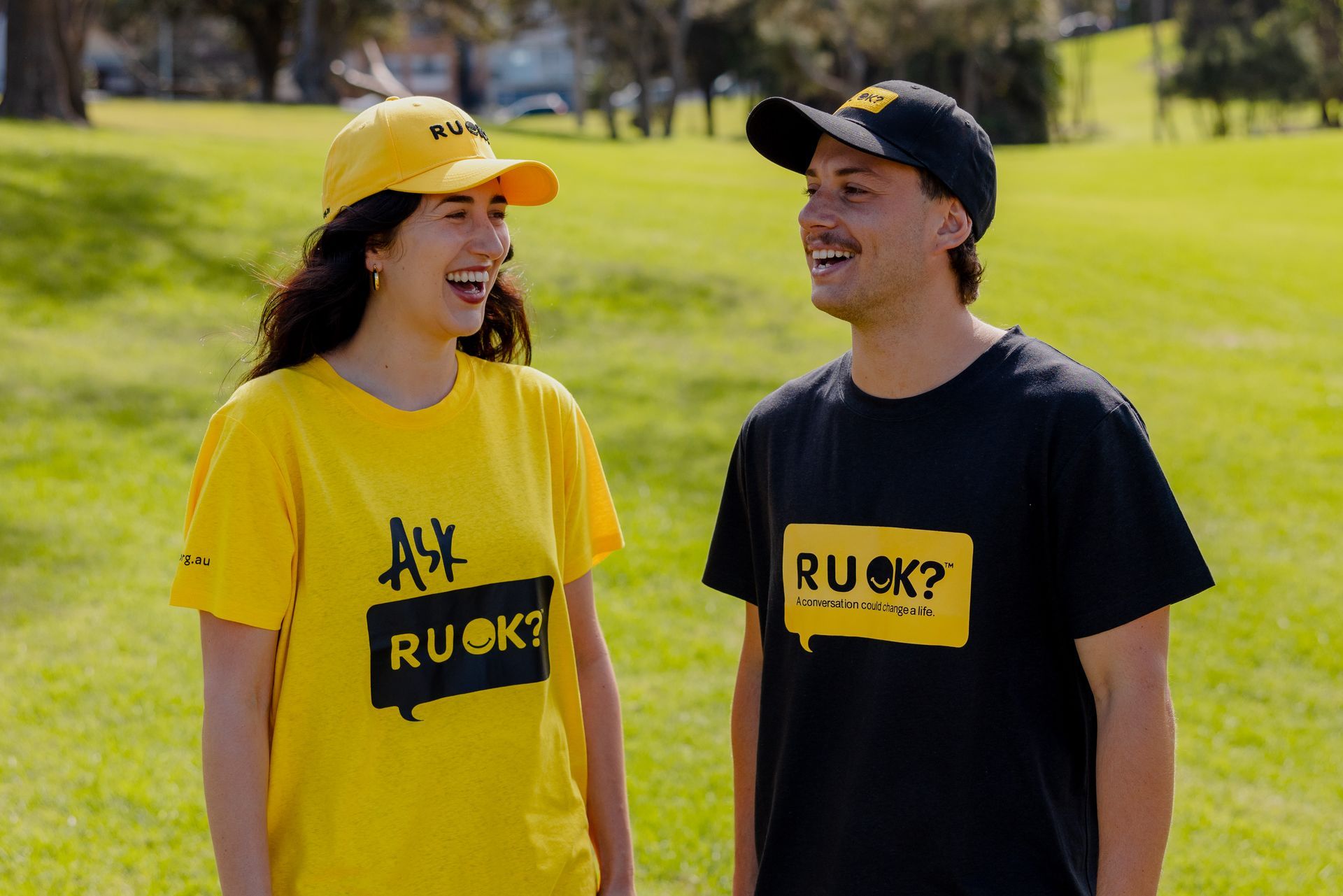 Two people in R U OK? gear talking