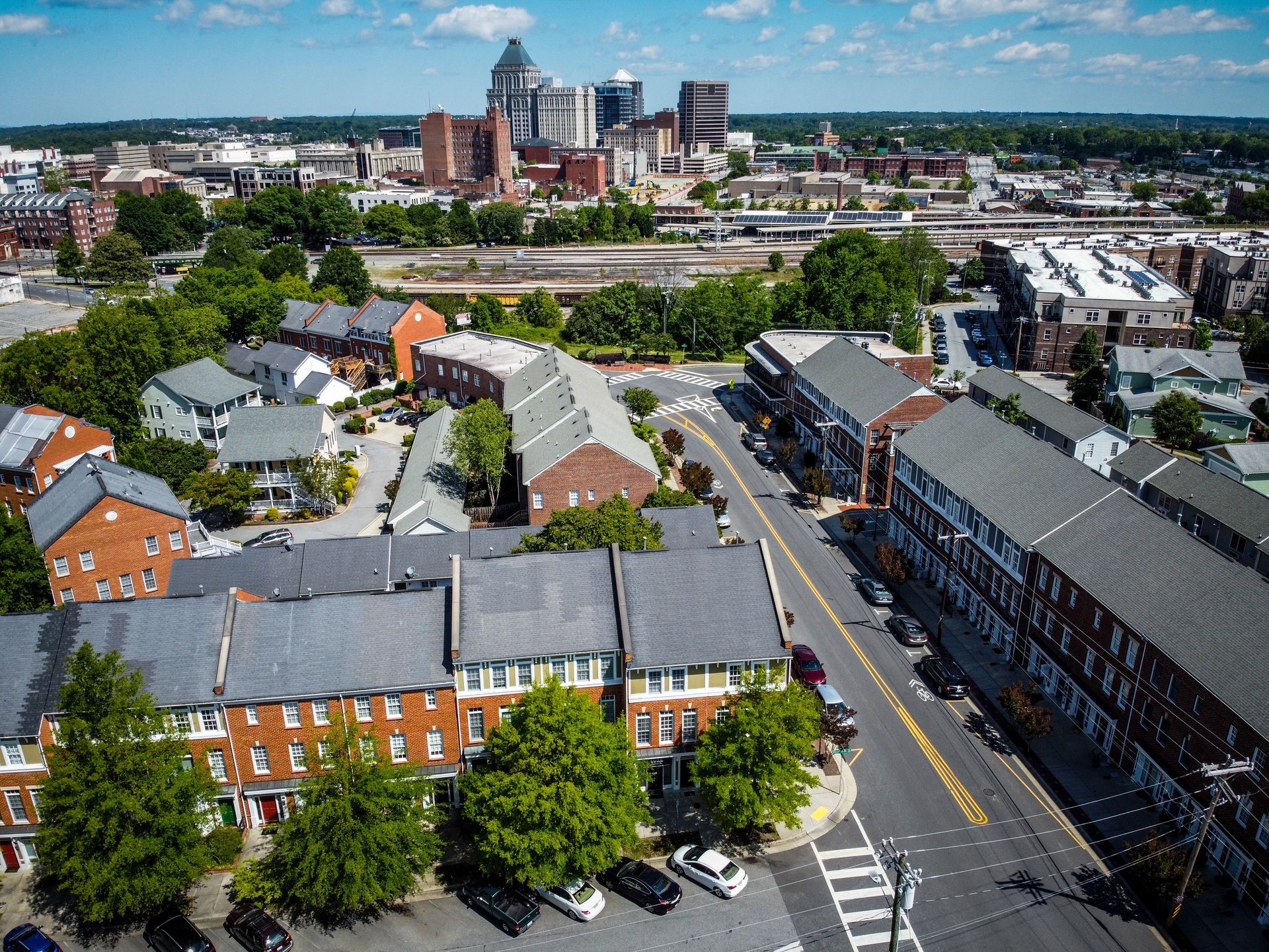 Aerial view of downtown Greensboro NC and nearby neighborhoods in the Triad