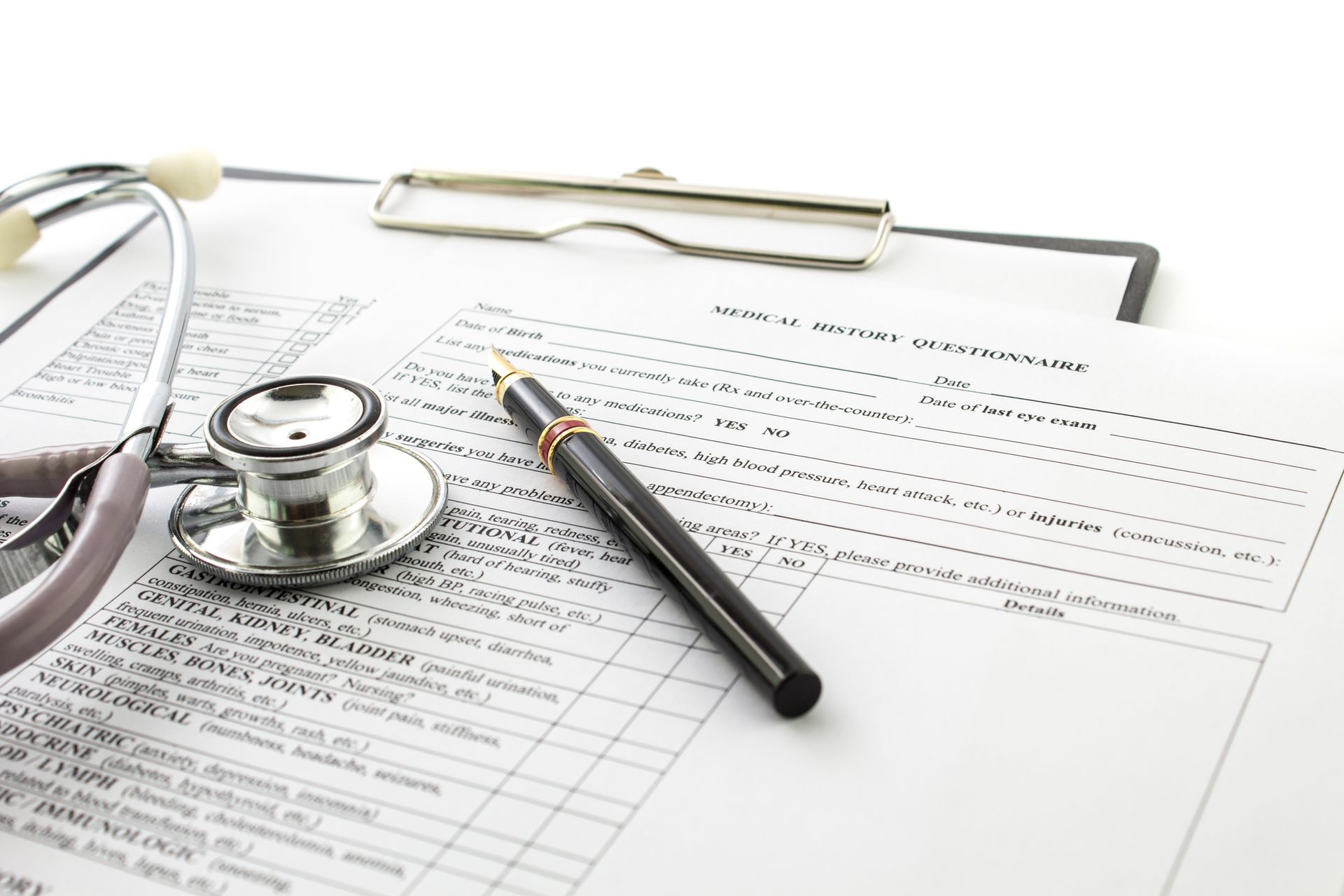 A stethoscope rests on top of an open book
