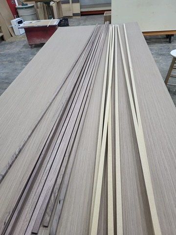 A wooden table with a bunch of wooden sticks on it.