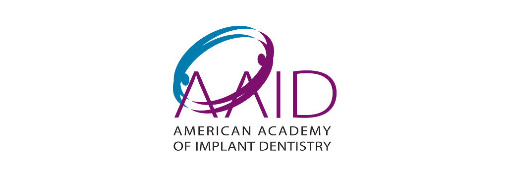 Logo for the American Academy of Implant Dentistry featuring blue and purple stylized rings over the text AAID.