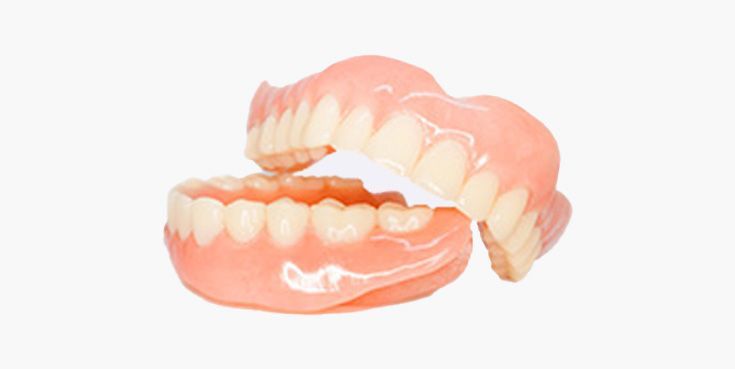 Two sets of dentures, top and bottom, pink and white against a white background.
