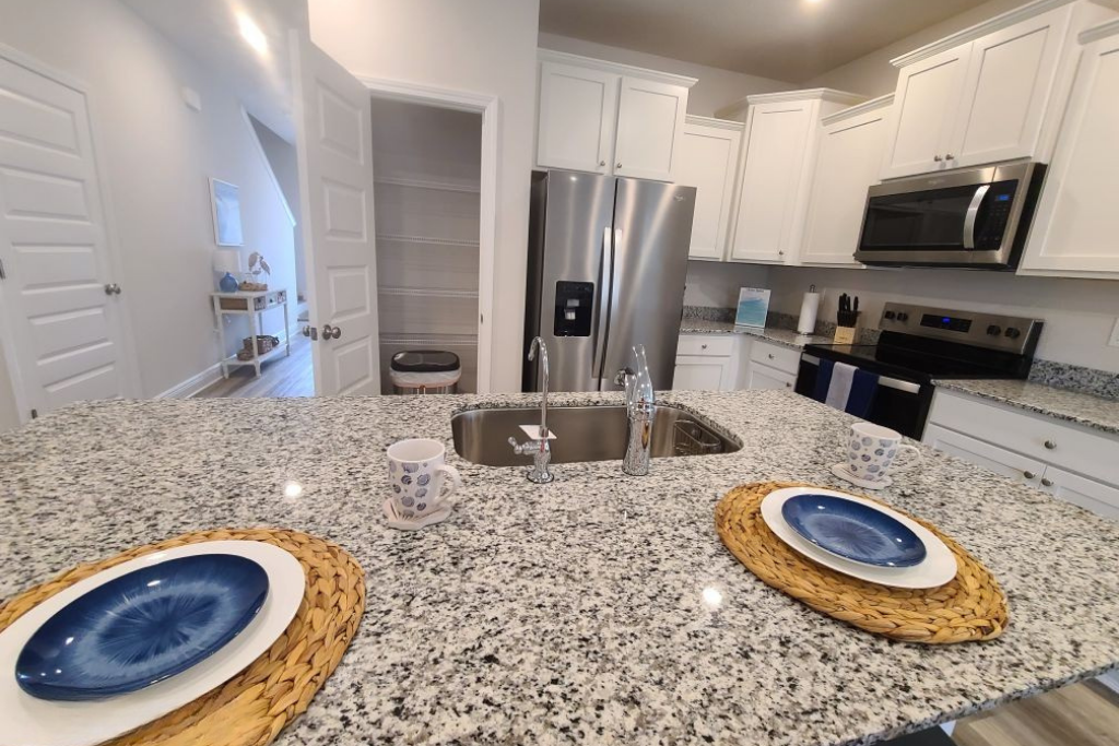 Bright coastal kitchen and dining area at Coastal Tide Escapes in PCB.