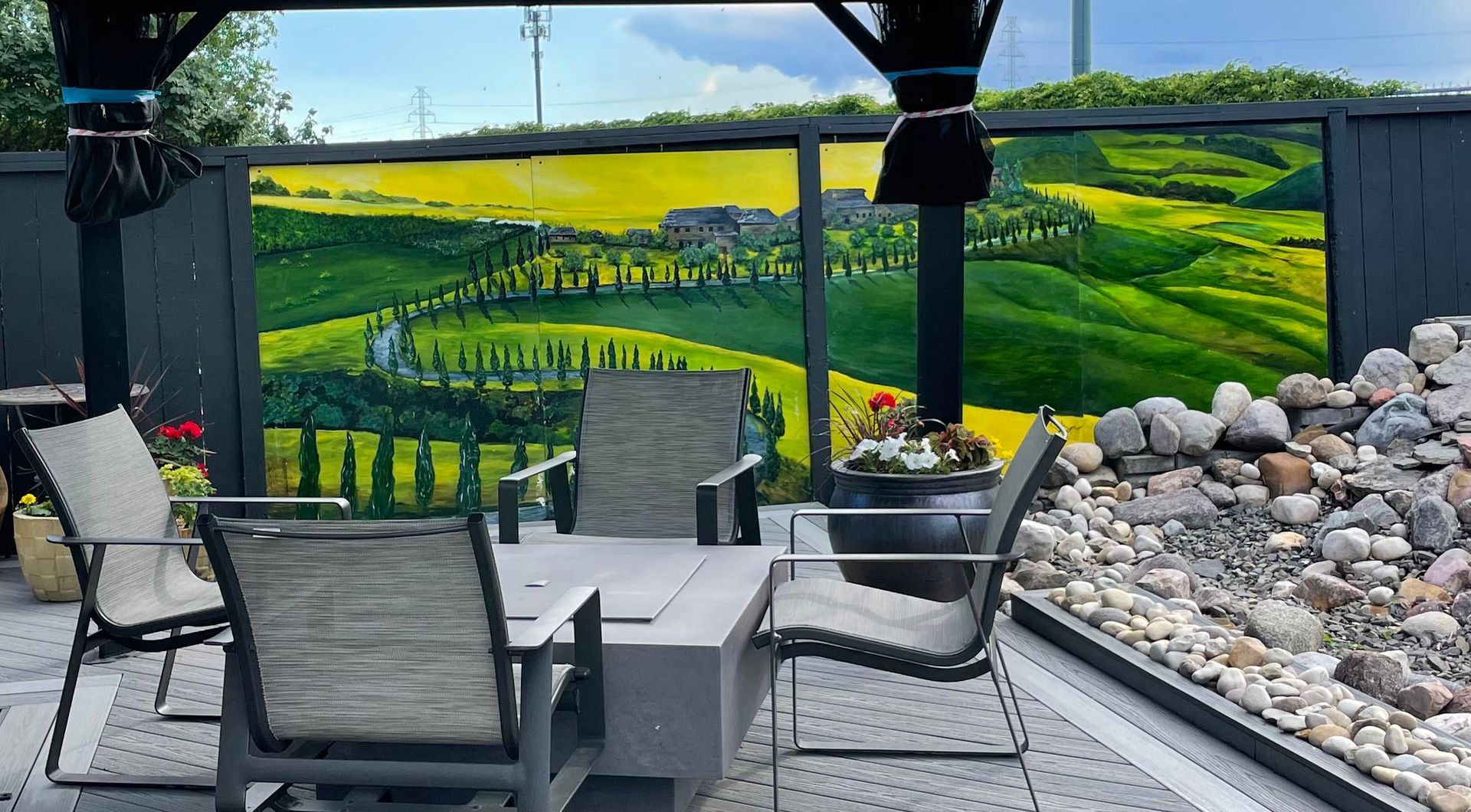 A taste of Tuscany in Glen and Darla Zuk's back yard. Painted on four panels and sealed for outdoors.