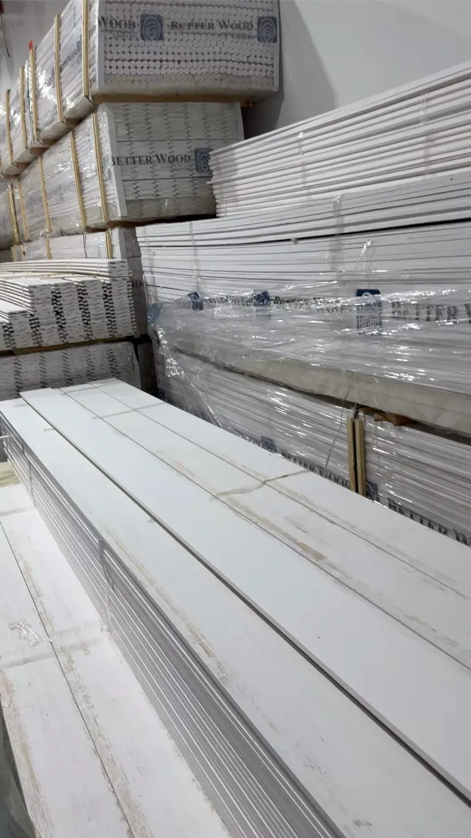 A warehouse filled with lots of white boards stacked on top of each other.