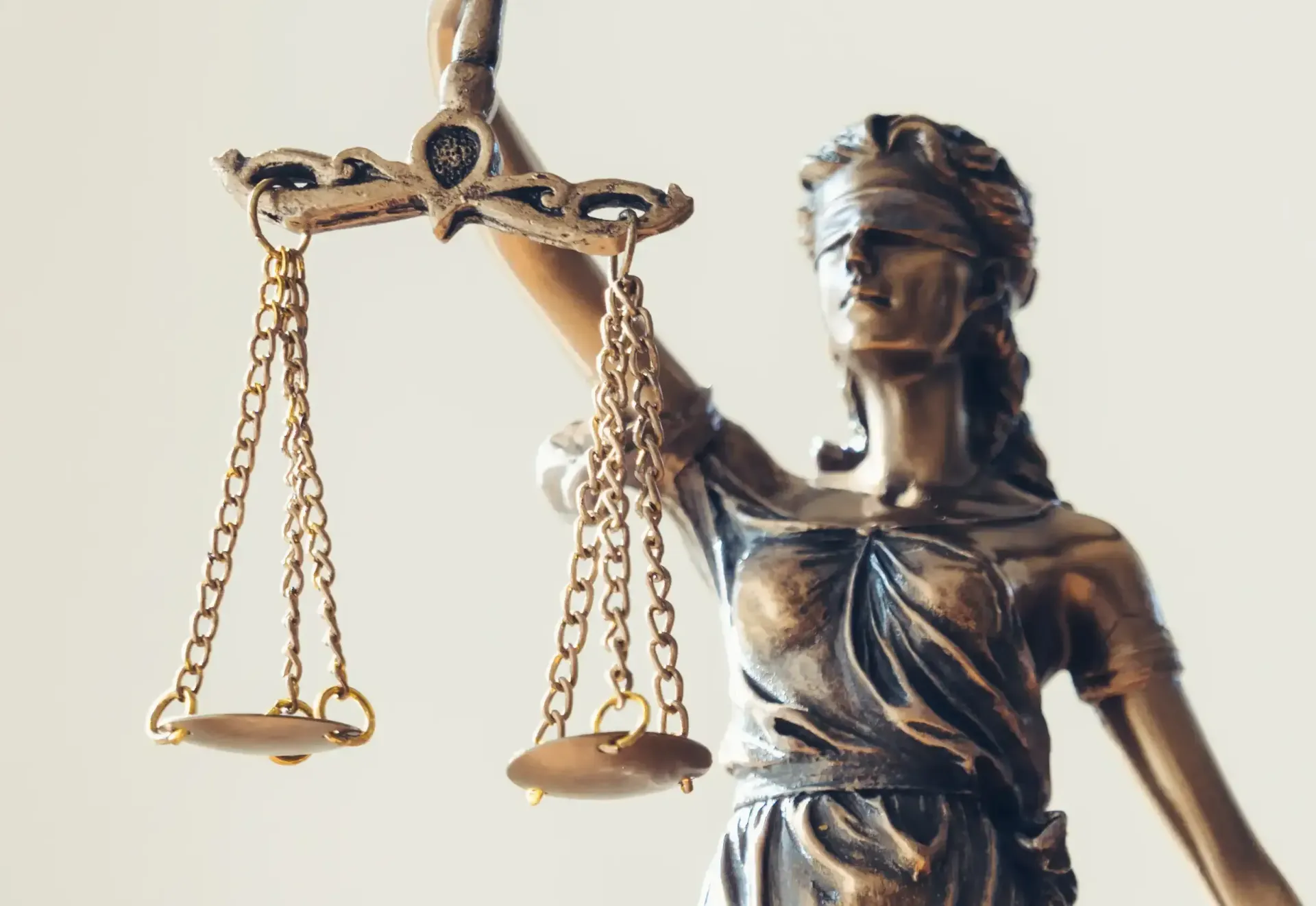 A statue of a woman holding a pair of scales of justice.