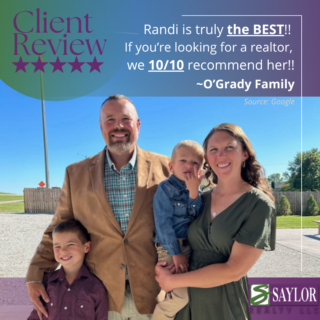 A family smiling in front of a building; text: