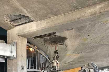 A close up of a concrete structure with a hole in it.