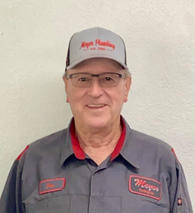 A man wearing a hat with the word mayor on it