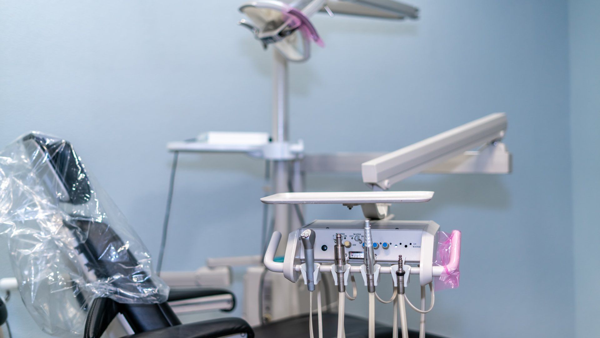 A dental office with a dental chair and dental equipment.
