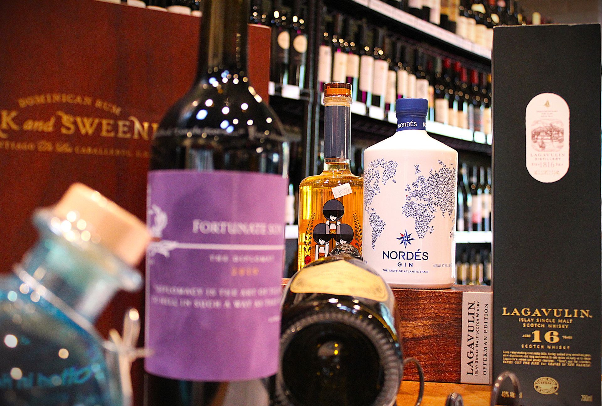 Several bottles of alcohol are on display including a bottle of k and sweeney