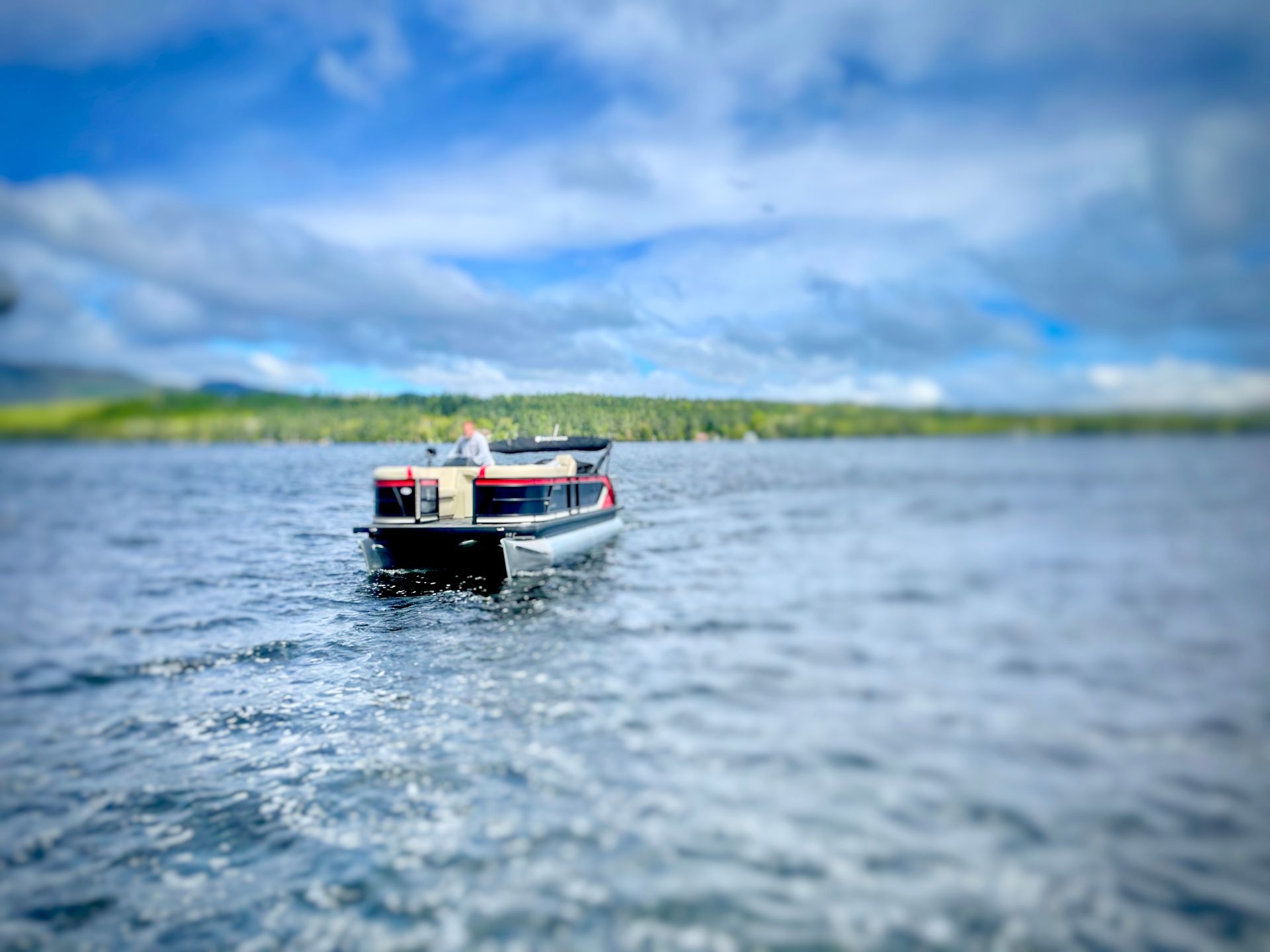 Cruising on a pontoon boat Pontoon boat cruising on an Adirondack lake
