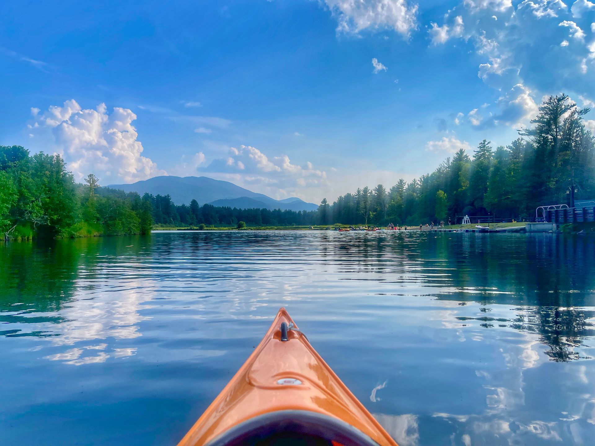 Kayak gliding through a lake in the Adirondack Park, NY