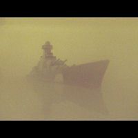 Handmade wooden warship model. Features: main guns, camouflage paint