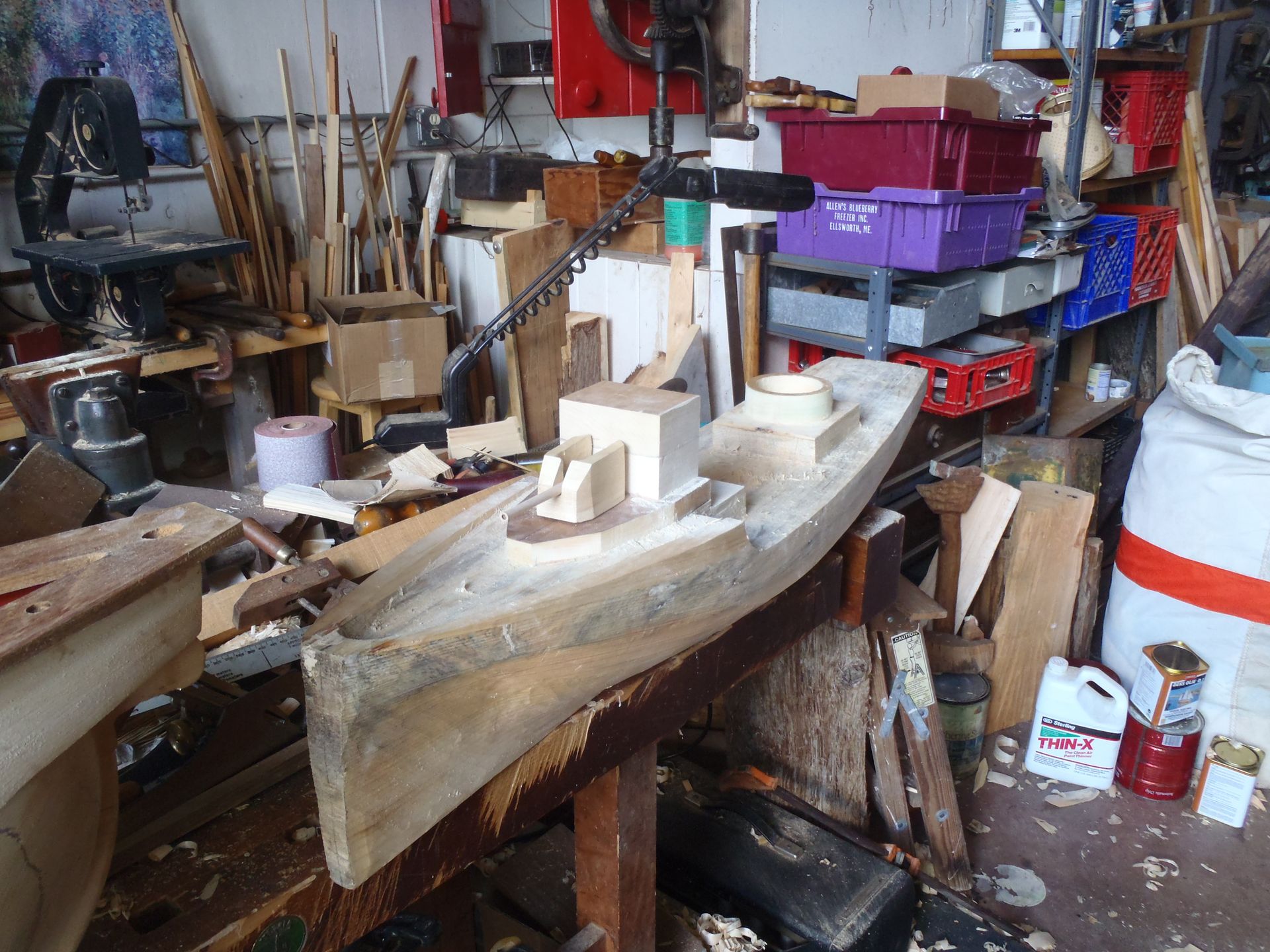 a woodworking shop with a purple container that says ' timber ' on it