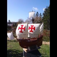 a model of a pirate ship is sitting on top of a table .