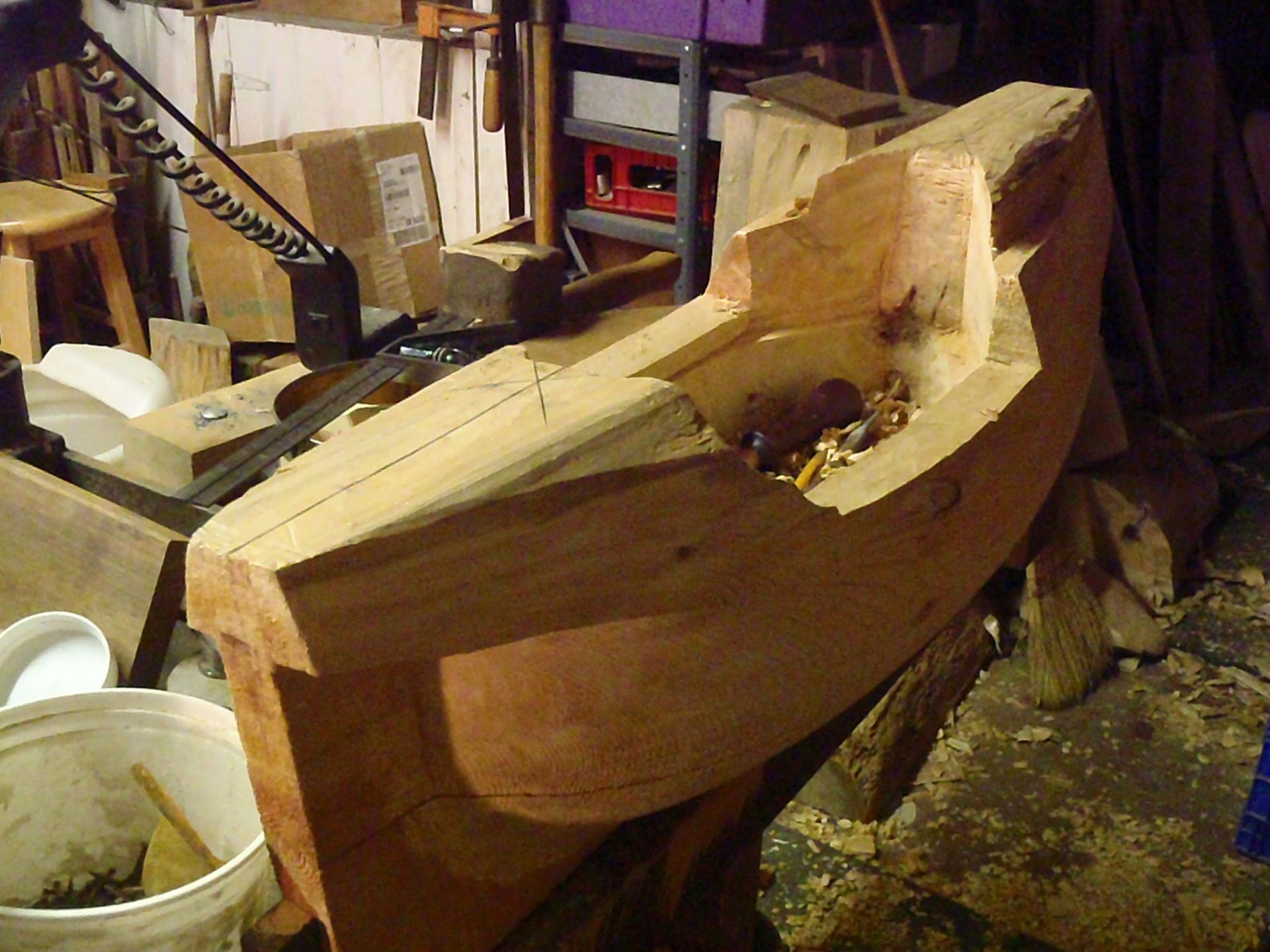 a large piece of wood is being worked on in a workshop