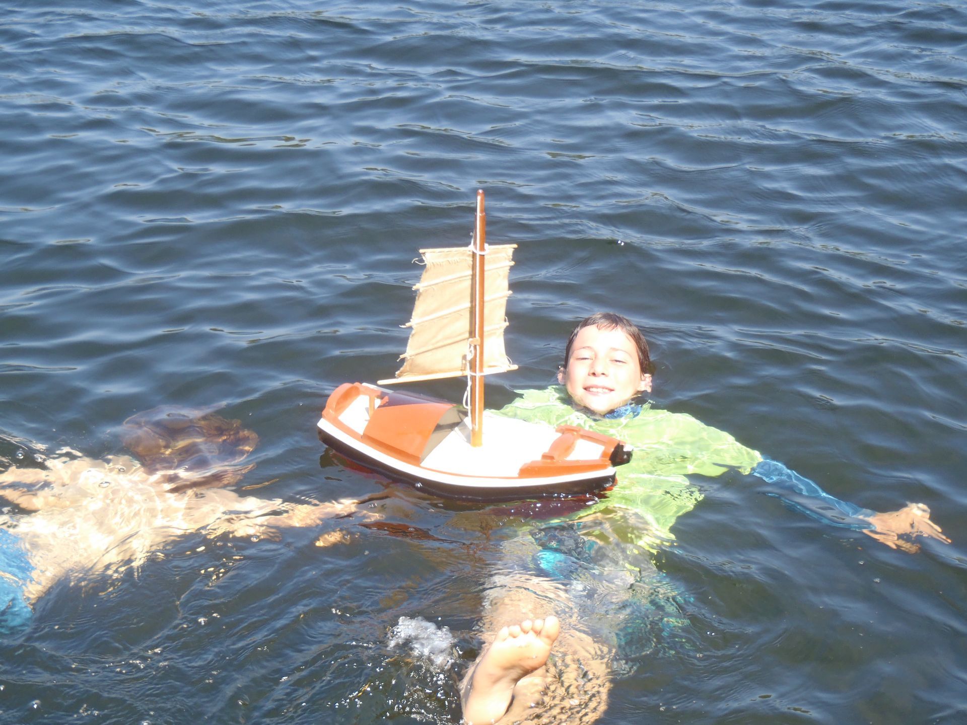 A Chinese Junk handmade cedar wood boat personal flotation device is undergoing a buoyancy test