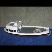 a toy boat is sitting on top of a blue table .