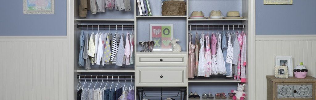 A closet filled with lots of clothes and shoes.