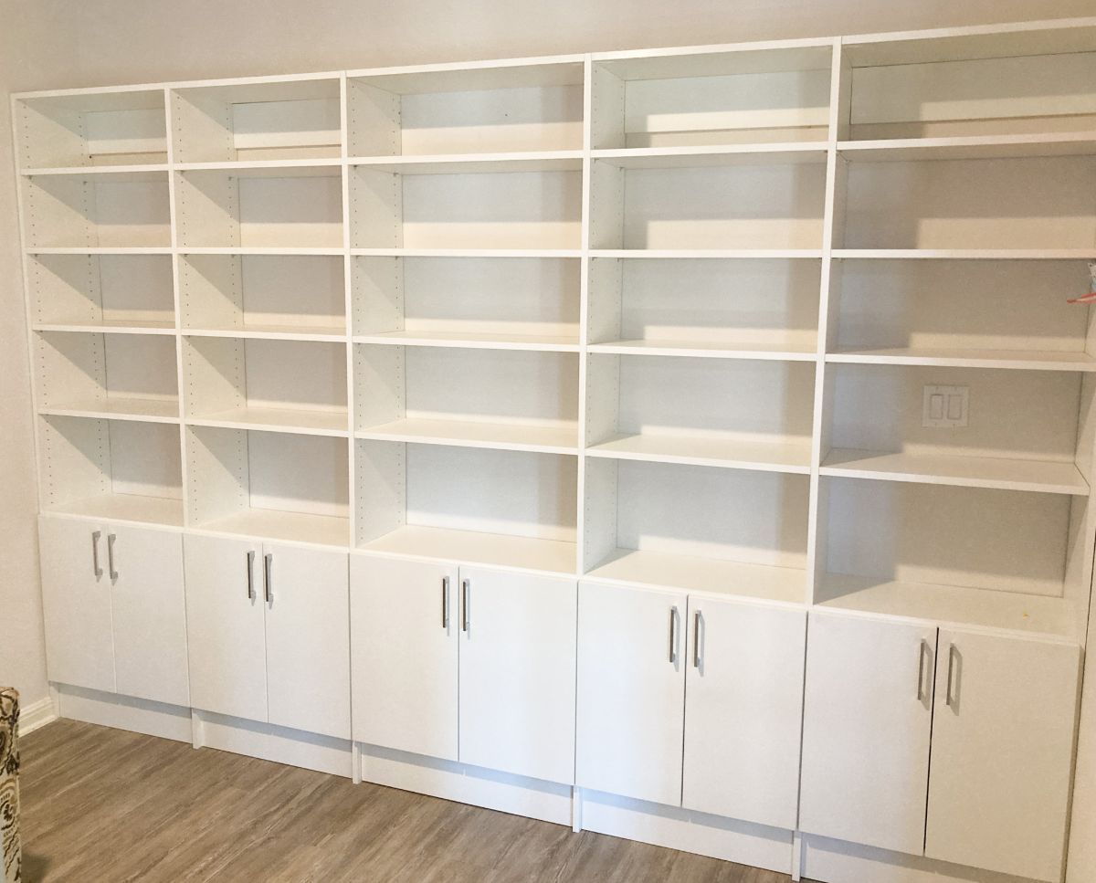 There are a lot of shelves and cabinets in this room.