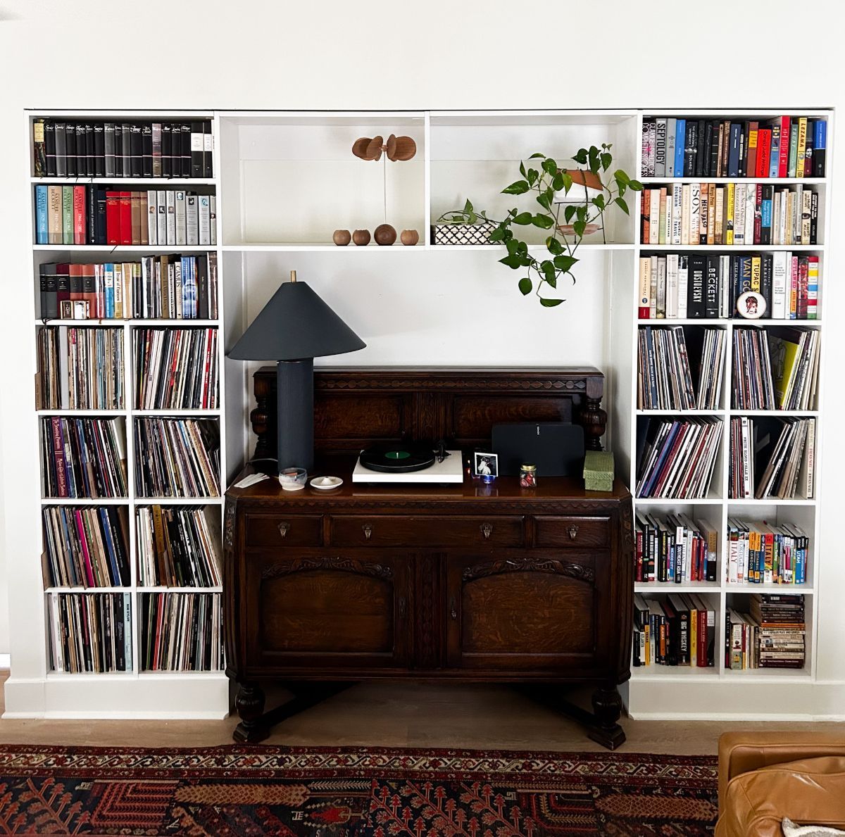 A living room filled with books and a record player