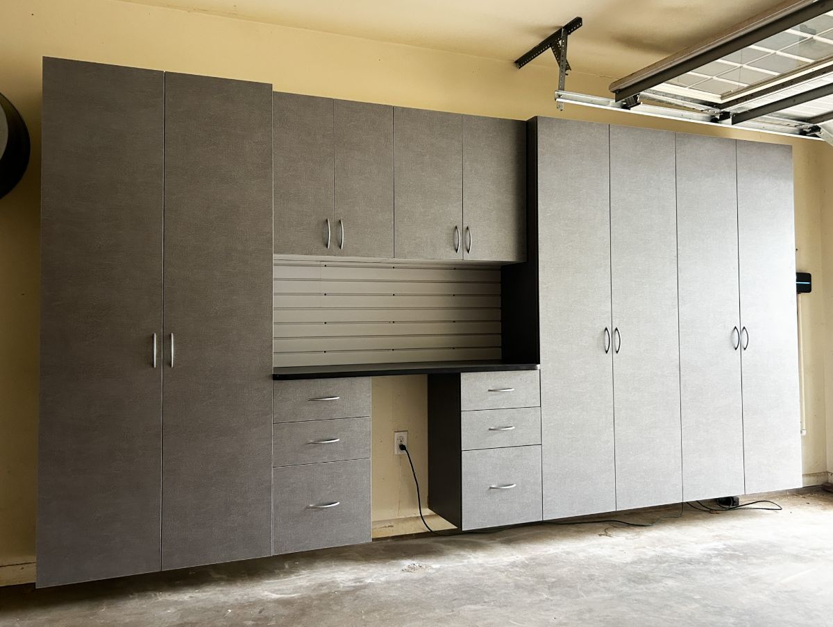 A garage with a lot of cabinets and drawers