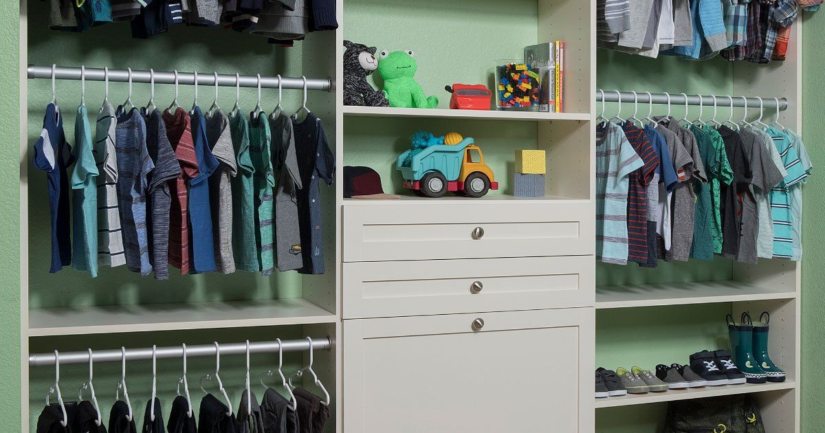 a child's closet filled with clothes and toys .
