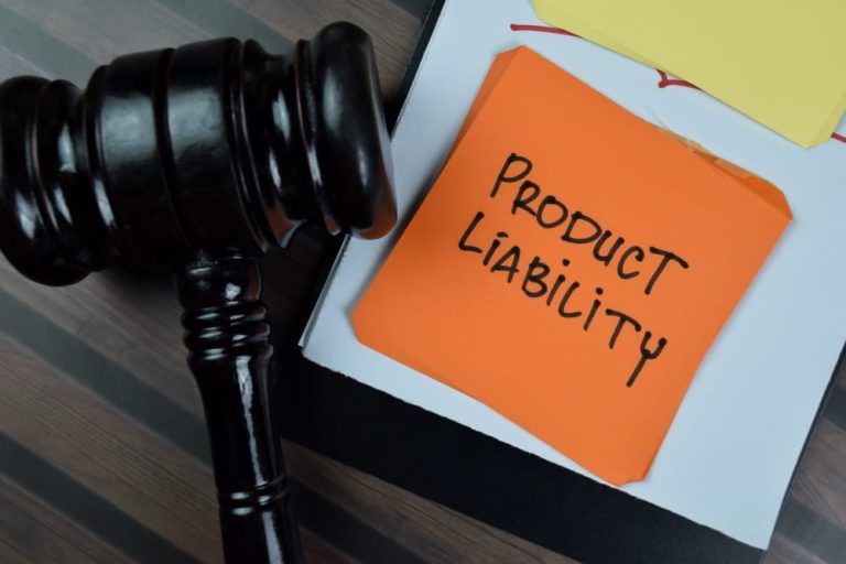 A judge 's gavel next to a note that says product liability