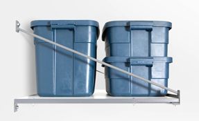 two blue plastic bins are stacked on top of each other on a shelf .