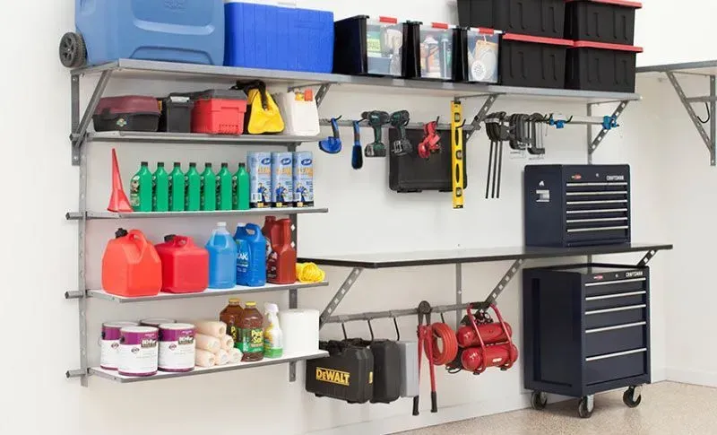 a garage filled with lots of shelves and tools .