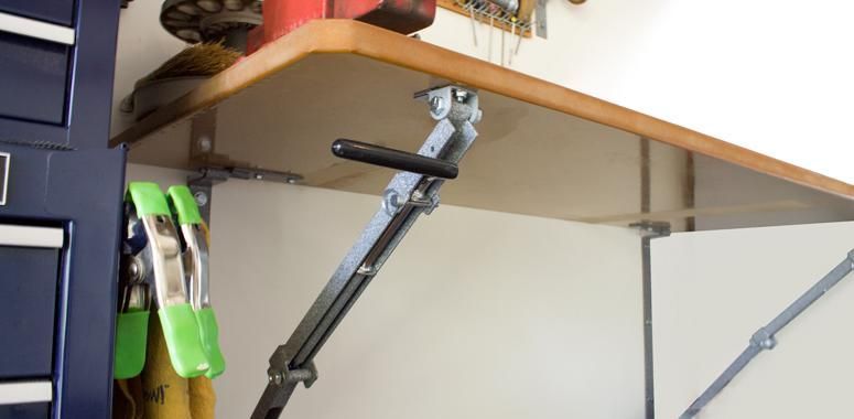 a folding workbench showing the collapse handle .