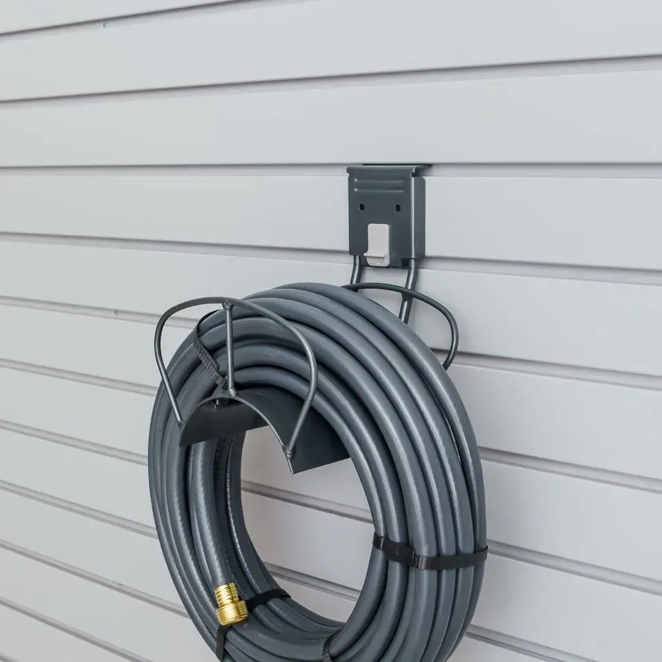 a hose is hanging on a hook on a slatwall system .