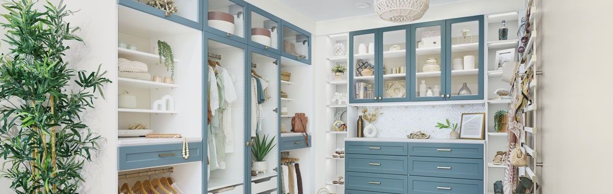 Lagoon and white finish closet system with shelves, drawers, and hanging rods for organized storage.
